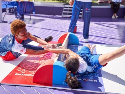 International mas-wrestling teams clash again on Russky Island 