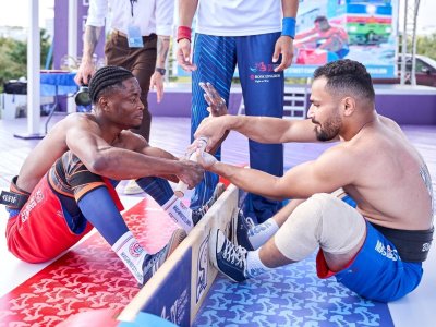 International mas-wrestling teams clash again on Russky Island 