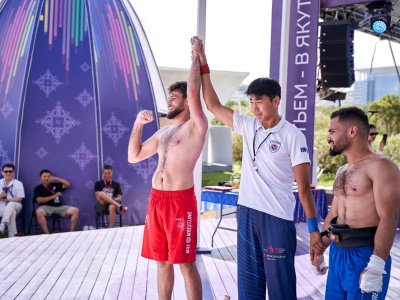 International mas-wrestling teams clash again on Russky Island 