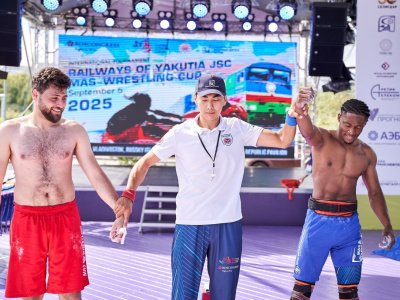 International mas-wrestling teams clash again on Russky Island 