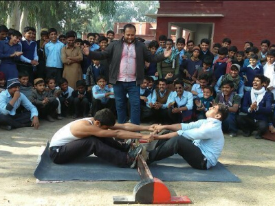 Mas-wrestling is becoming more popular in Pakistan. Photo