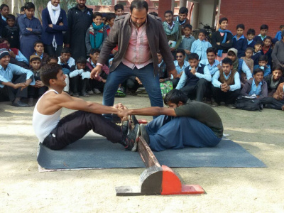 Mas-wrestling is becoming more popular in Pakistan. Photo