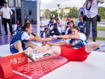 International mas-wrestling teams clash again on Russky Island 