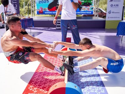 International mas-wrestling teams clash again on Russky Island 