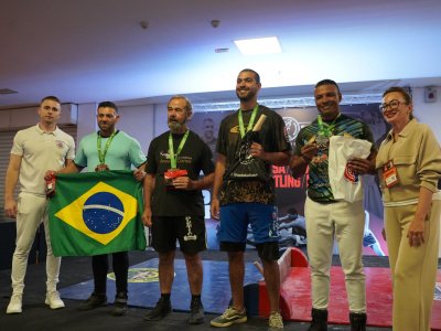 The South American Mas-wrestling Championship kicked off with friendly embraces
