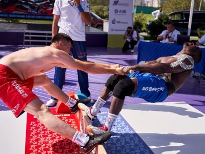 International mas-wrestling teams clash again on Russky Island 