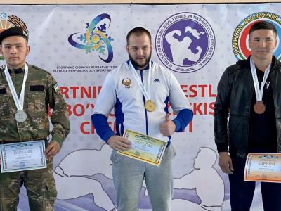 Participants of the Uzbekistan Mas-Wrestling Championship greet friends around the world