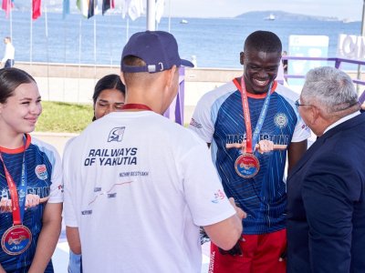 International mas-wrestling teams clash again on Russky Island 