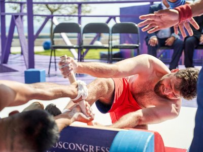 International mas-wrestling teams clash again on Russky Island 