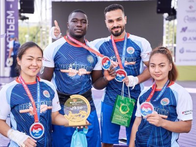 International mas-wrestling teams clash again on Russky Island 