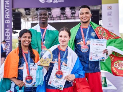 International mas-wrestling teams clash again on Russky Island 